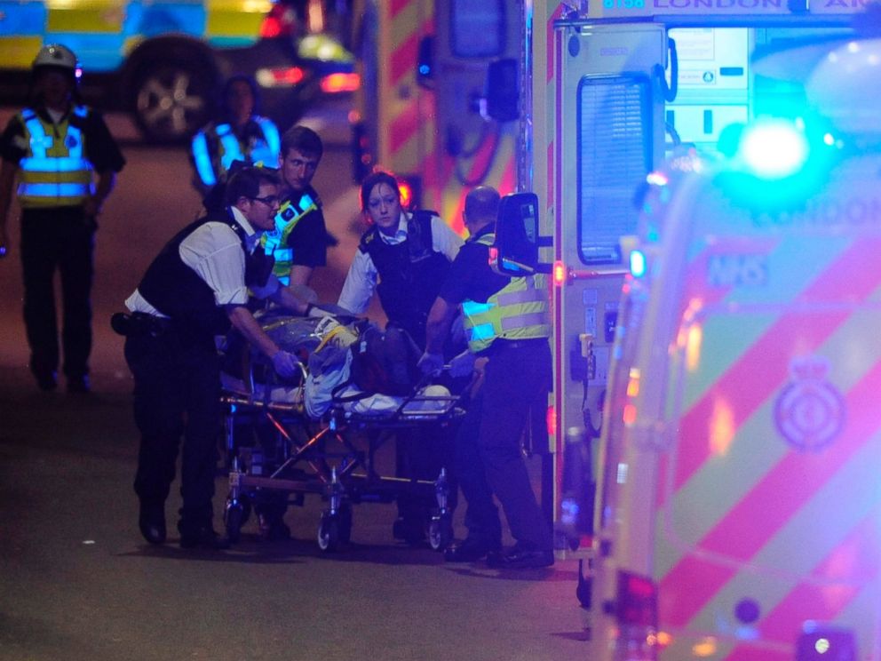 PHOTO: Police officers and members of the emergency services attend to a person injured in an incident on London Bridge in central London on June 3, 2017.