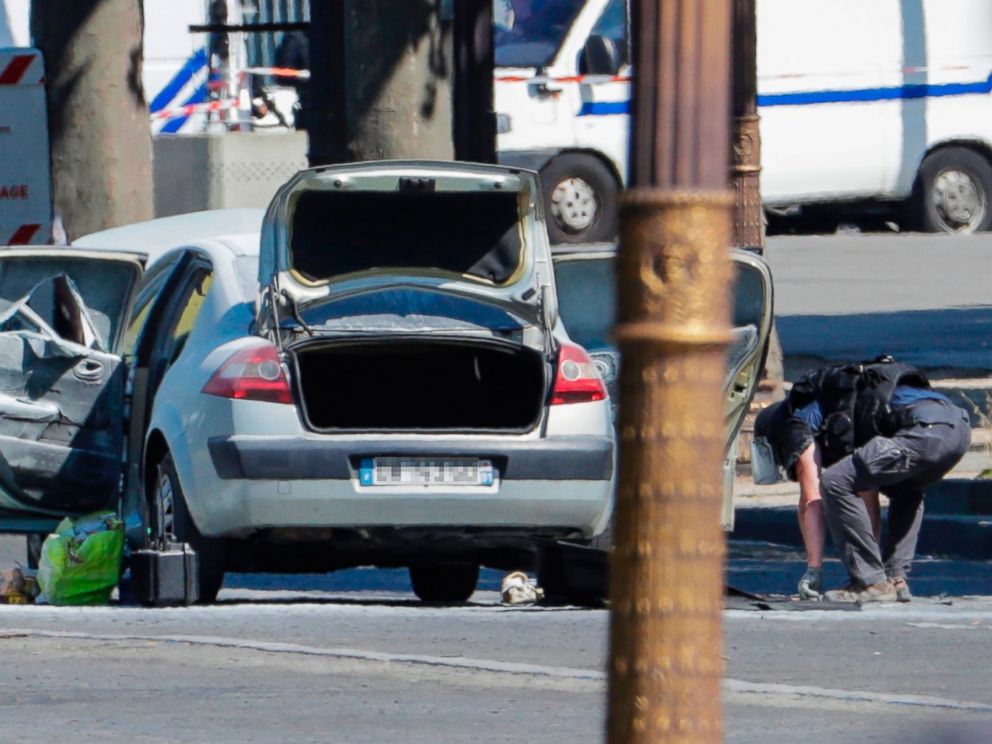 PHOTO: A bomb disposal police officer checks a car in a sealed off area on the Champs-Elysees avenue in Paris, June 19, 2017.