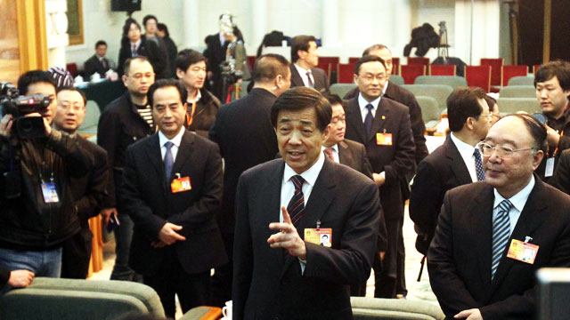 PHOTO: Bo Xilai, the charismatic head of China's Chongqing municipality, talks to reporters as he arrives for a meeting where he vowed to continue a sensational crackdown on organized crime, at the annual National People's Congress (NPC) in the Great Hall