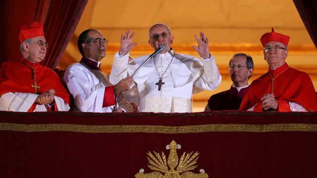 PHOTO: New Pope, Argentinian cardinal Jorge Mario Bergoglio appears at the window of St Peters Basilicas balcony after being elected the 266th pope of the Roman Catholic Church, March 13, 2013 at the Vatican.