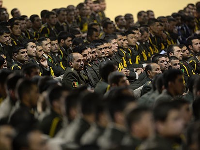 PHOTO: Afghan defense officers attend a security handover ceremony at a military academy outside Kabul, June 18, 2013.
