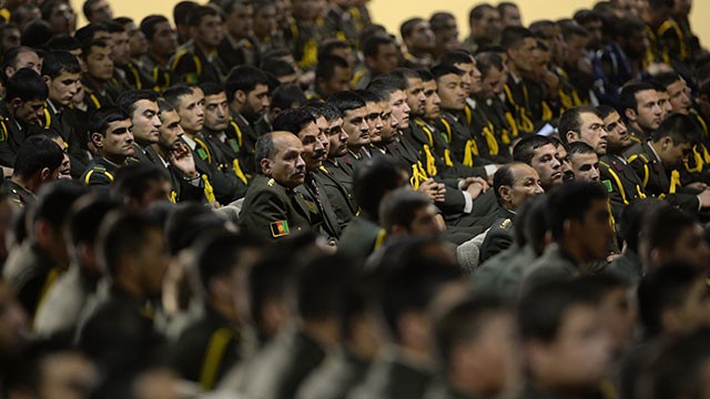 PHOTO: Afghan defense officers attend a security handover ceremony at a military academy outside Kabul, June 18, 2013.