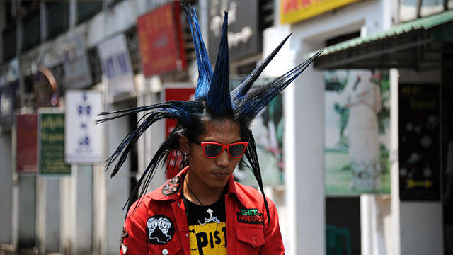 PHOTO: A punk arrives at the Bogyoke market during the first day of Thingyan in Yangon.