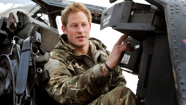 PHOTO: Prince Harry or just plain Captain Wales as he is known in the British Army, makes his early morning pre-flight checks on the flight-line, from Camp Bastion southern Afghanistan, Dec. 12, 2012.