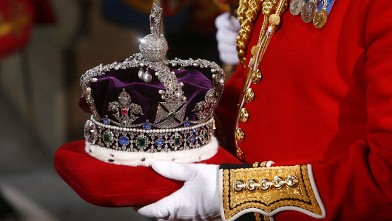 PHOTO: The Imperial State Crown, worn by Queen Elizabeth II during her speech for the State Opening of Parliament, is carried from the Houses of Parliament in London, England.