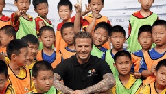 PHOTO: David Beckham poses with young fans at Nanjing Olympic Sports Center, June 18, 2013, in Nanjing, Jiangsu Province of China.