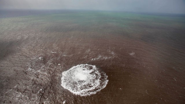 PHOTO: Aerial view taken, Oct. 17, 2011 of a green and brown stain at sea off the coast of the village of La Restinga on the Spanish Canary Island of El Hierro.