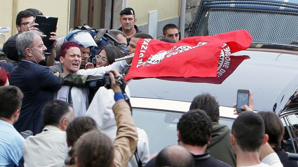 PHOTO: People protest as the hearse with the body of Nazi war criminal Erich Priebke arrives at the church of Lefebvriani, Oct. 15, 2013, in Albano Laziale, Italy.