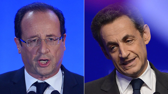 PHOTO: Socialist Party (PS) newly elected president Francois Hollande gives a speech after the results of the second round of the presidential election on May 6, 2012 in Tulle, southwestern France, and Right-wing incumbent candidate Nicolas Sarkozy (R) ad