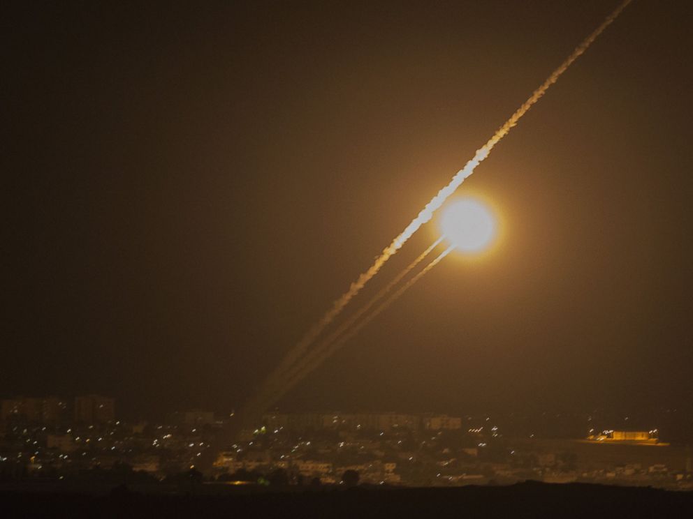 PHOTO: A picture taken from the southern Israeli Gaza border shows rockets being fired from the Gaza strip into Israel, on July 12, 2014.