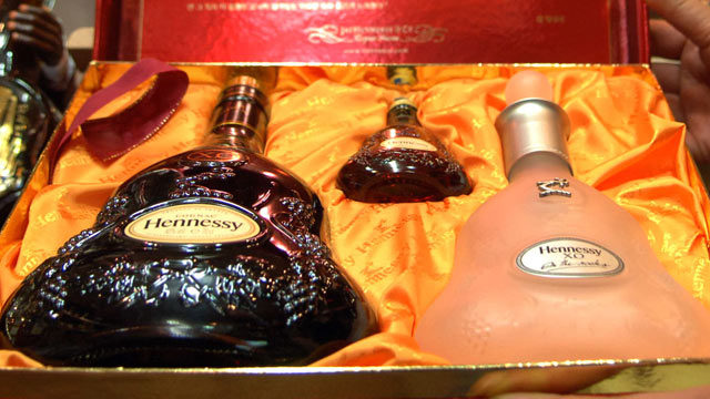 PHOTO: A liquor store owner shows displayed Hennessy cognac bottles in Seoul Korea, in this 2006 file photo. The United Nations is hitting Kim Jong Il where it hurts, cutting off trade in the luxury goods favored by the North Korean dictator and his entou