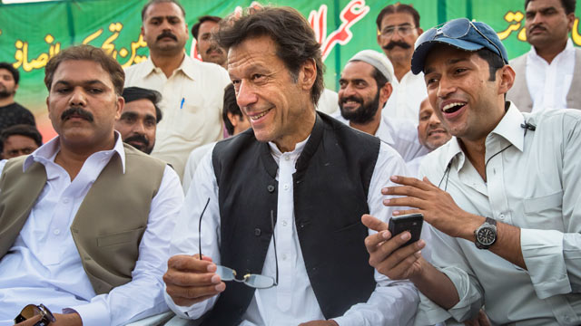 PHOTO: Imran Khan, center, smiles as he addresses supporters during an election campaign rally, May 1, 2013, in Narowal, Pakistan.