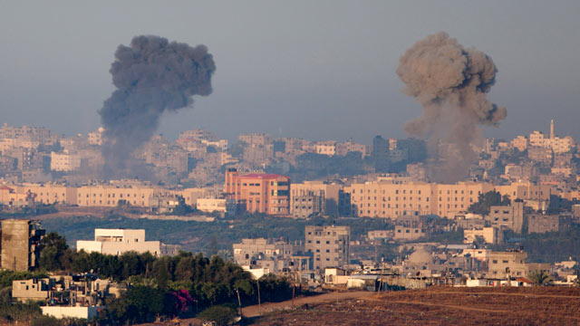 PHOTO: Plumes of smoke rise over Gaza during an Israeli air strike, as seen from Sderot on November 15, 2012 in Israel.
