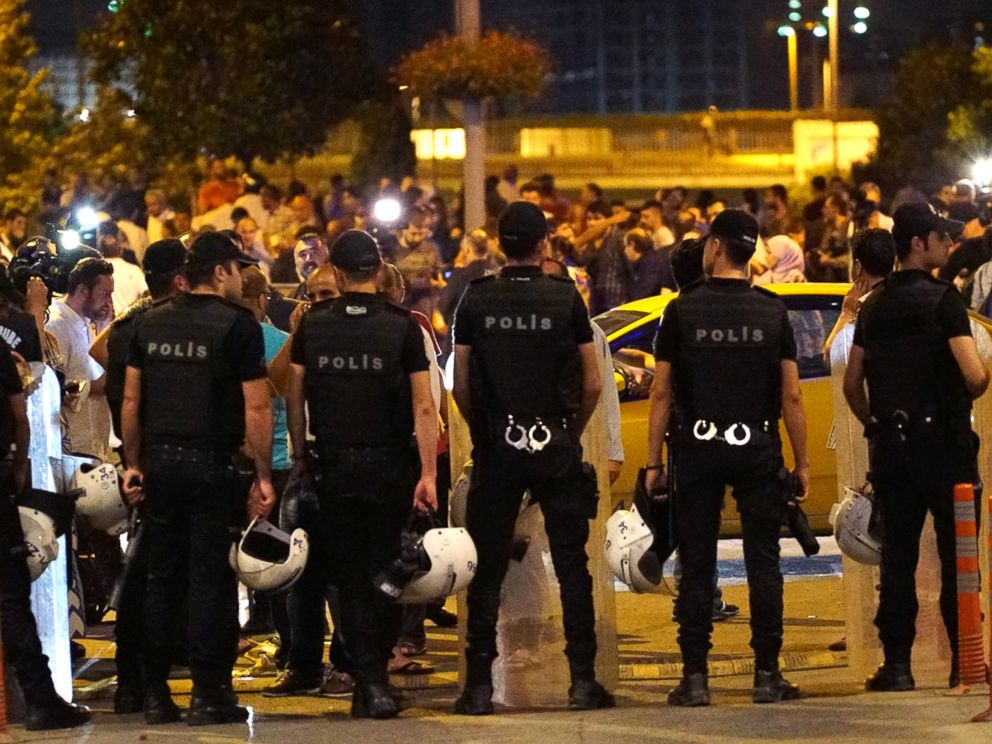 PHOTO: Turkish police blocks the road as relatives wait outside the Turkeys largest airport, Istanbul Ataturk, following the suicide bomb attack, June 28, 2016 in Istanbul, Turkey