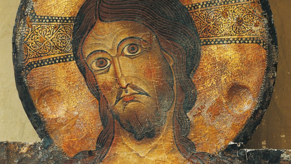 PHOTO: Christs face is seen in a detail from the Crucifix, 1187, by Alberto Sotio, Cathedral of the Assumption of Mary, Spoleto, Umbria, Italy.
