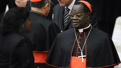 PHOTO: Laurent Monsengwo Pasinya speaks with a relative, November 2010, at the Paul VI hall at The Vatican.