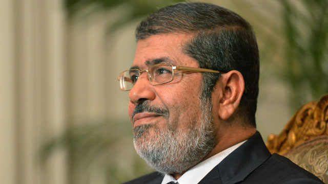 PHOTO: President Mohamed Morsi attends a meeting with UN Secretary General Ban Ki-moon (unseen) at the presidential palace in Cairo, November 21, 2012.
