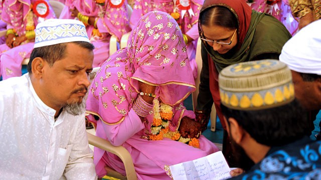PHOTO: An Indian Muslim bride, center, answers questions by religious leaders during the "Nikah Kabool Hai" or "Do You Agree for the Marriage."