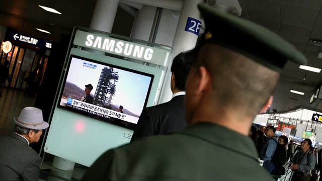 PHOTO: A South Korean marine watches a television report on North Koreas rocket launch at Seoul Station in Seoul, South Korea, April 13, 2012.