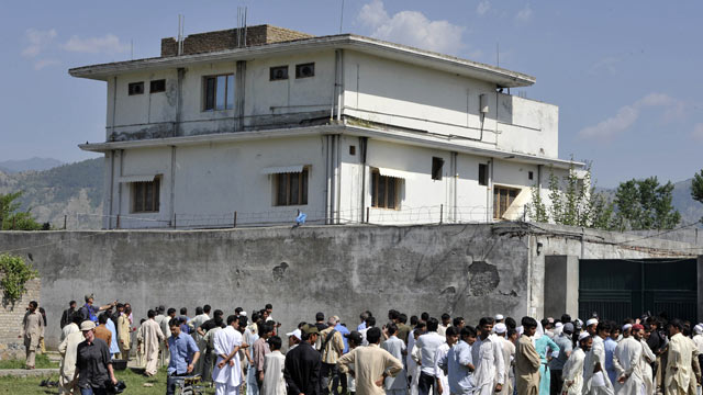 PHOTO: Pakistani media personnel and local residents gather outside the hideout of Al-Qaeda leader Osama bin Laden following his death by US Special Forces in a ground operation, May 3, 2011, Abbottabad, Pakistan.