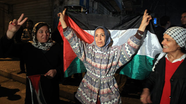 PHOTO: Palestinians celebrate in the street of Gaza City, November 21, 2012 as a ceasefire came into effect in and around Gaza after a week of cross-border violence between Israel and Hamas.