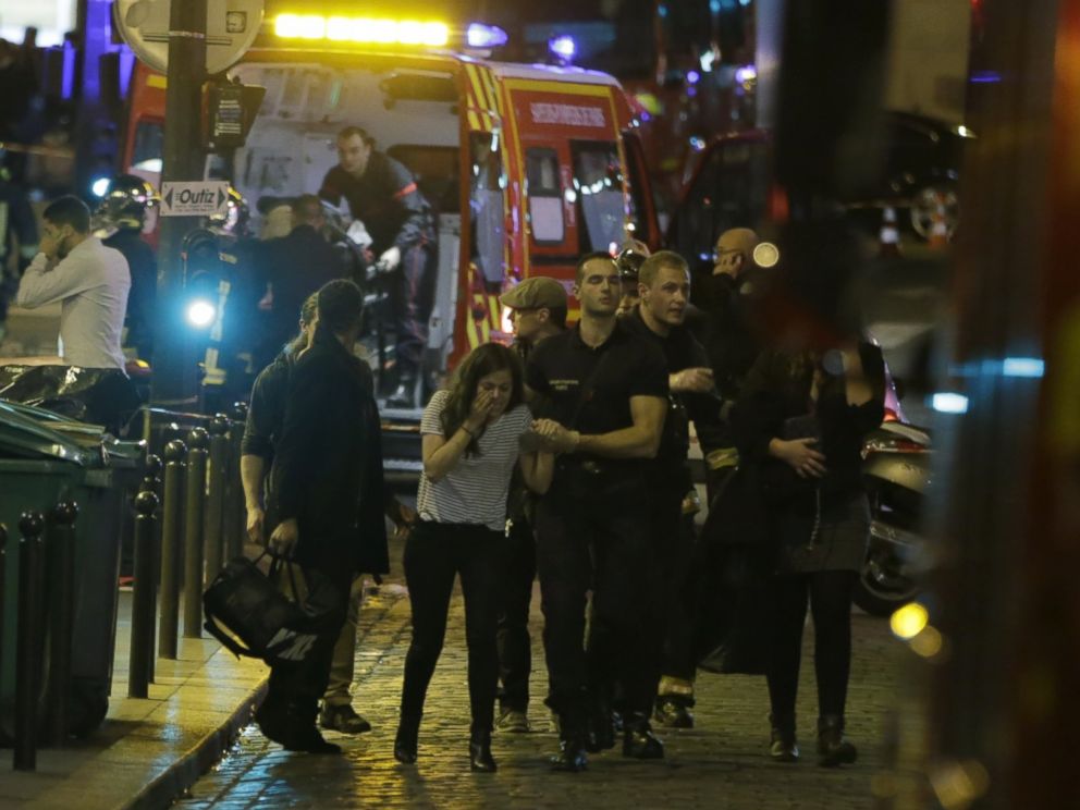 PHOTO: French security moves people in the area of Rue Bichat in the 10th arrondissement of the French capital Paris following a string of attacks on Nov. 13, 2015.