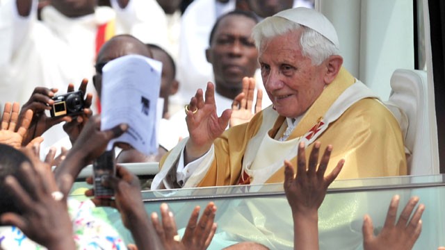 PHOTO: Pope Benedict XVI waves to faithfuls as he leaves after celebrating a mass at the Friendship Stadium in Cotonou, Nov. 20, 2011.