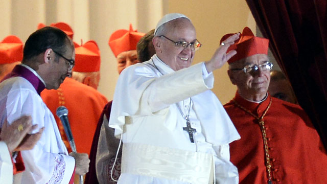 PHOTO: Argentinas cardinal Jorge Bergoglio, elected Pope Francis I appears with cardinals at the window of St Peters Basilica after being elected the 266th pope of the Roman Catholic Church on March 13, 2013 at the Vatican.