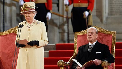 PHOTO: Queen Elizabeth II makes an address next to her husband The Duke of Edinburgh at Westminster Hall in London, March 20, 2012