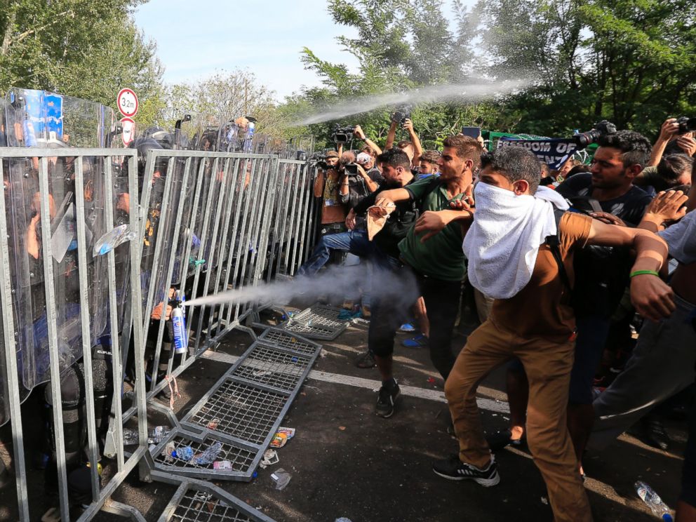 PHOTO: Hungarian police use pepper spray against refugees at the Horgos border after Hungarian authorities closed their border on Sept. 16, 2015 in Horgos, Serbia.