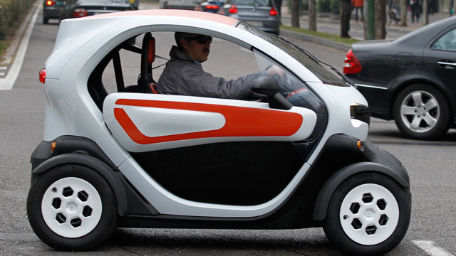 PHOTO: A Renault operator drives a Renault Twizy electric car around Valladolid, Spain, April 03, 2012.