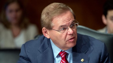 PHOTO: Sen. Robert Menendez, D-N.J., takes his seat for a Senate Banking, Housing and Urban Affairs Committee hearing on May 24, 2012.