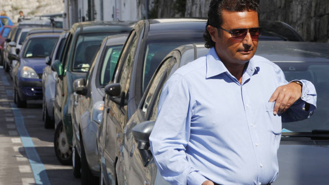 PHOTO: Costa Concordia cruise former captain Francesco Schettino walks to his car in Meta di Sorrento on October 14, 2012 in this file photo.