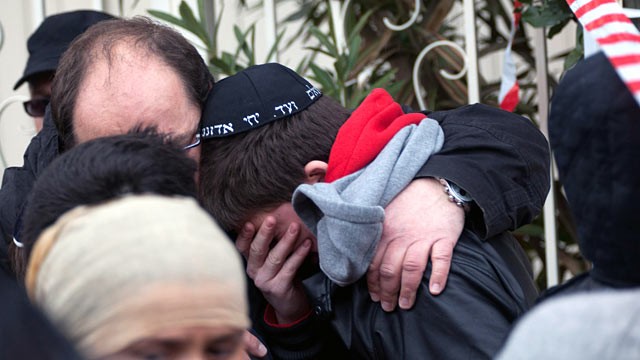 PHOTO: School children are comforted at the scene of a fatal shooting after a gunman opened fire outside the Ozar Hatorah school, March 19, 2012 in Toulouse, France.