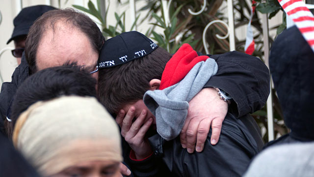 PHOTO: School children are comforted at the scene of a fatal shooting after a gunman opened fire outside the Ozar Hatorah school, March 19, 2012 in Toulouse, France.