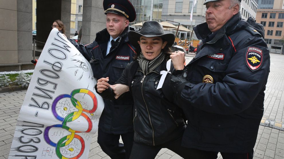 PHOTO: Police officers detain a gay rights activist during a protest outside the headquarters of the Sochi 2014 Organizing Committee in central Moscow, Sept. 25, 2013.