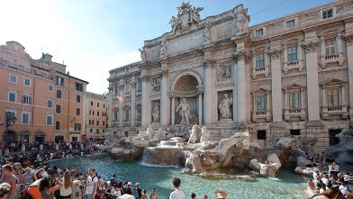 PHOTO: Tourists relax at central Rome's Trevi fountain monument on August 12, 2010.