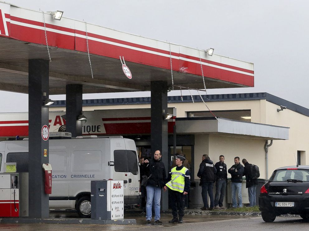 PHOTO: Gendarmes investigate where the two armed suspects from the attack on newspaper Charlie Hebdo were possibly spotted at an Avia gas station in Villers-Cotterets, north-east of Paris, Jan. 8, 2015.