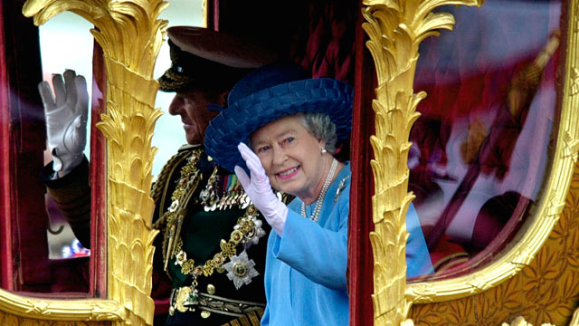 PHOTO: Queen Elizabeth II rides with Prince Philip in the Gold State Coach during the procession from Buckingham Palace to St. Paul's.