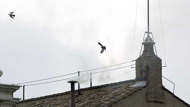 PHOTO: White smoke is seen from the roof of the Sistine Chapel indicating that the College of Cardinals have elected a new Pope on April 19, 2005 in Vatican City.