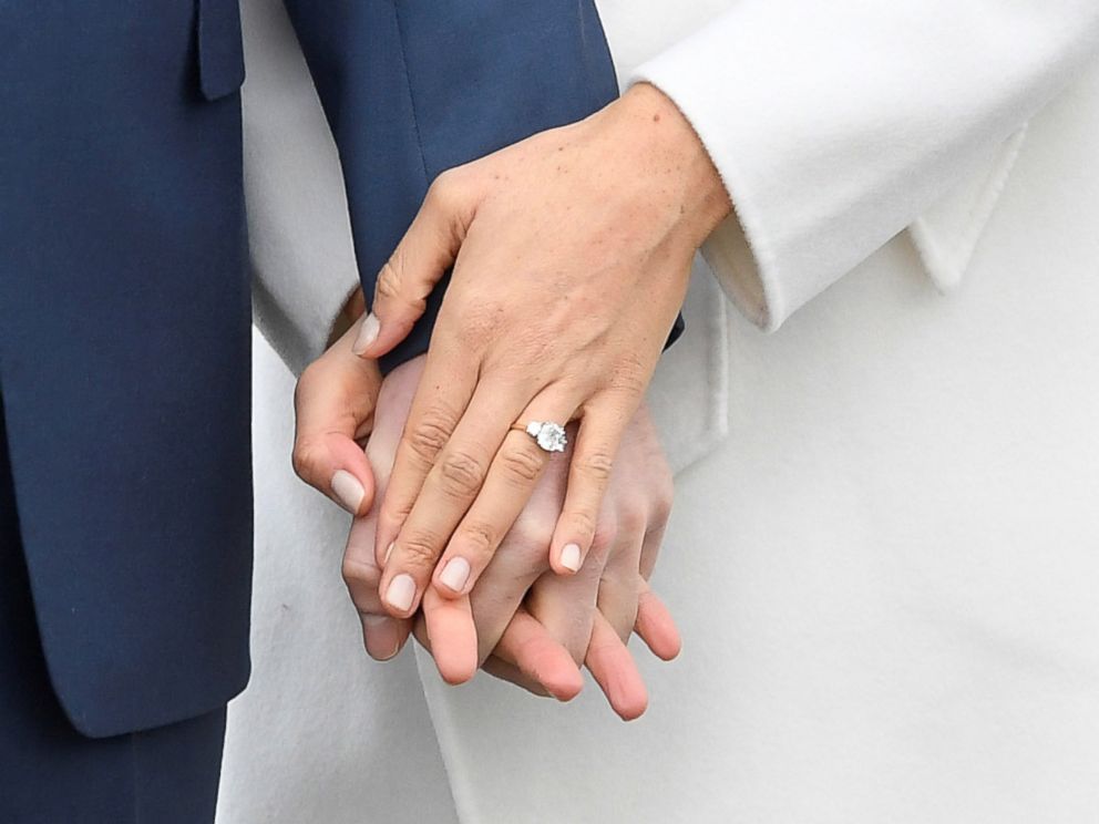 PHOTO: Britains Prince Harry holds hands with Meghan Marklem wearing an engagement ring in the Sunken Garden of Kensington Palace, London, Nov. 27, 2017. 