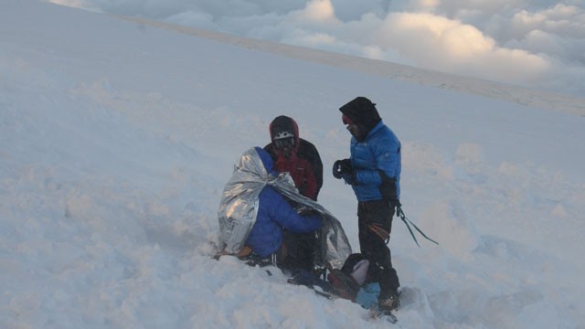 PHOTO: Rescuers put climbers in body heat wraps after at least nine climbers died and nine were injured following an avalanche July 12, 2012 in the French Alps.
