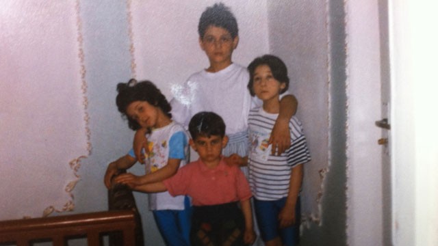 PHOTO: Sitting at her kitchen table, aunt Patemat Sulemanova cried softly as she showed ABC News photos of the two bombing suspects -- Tamerlan Tsarnaev and and Dhzokhar Tsarnaev when they were young boys. as they posed with their two sisters.