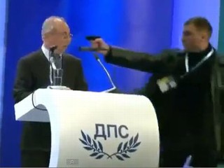 Man Puts Gun to Politician's Head During Speech