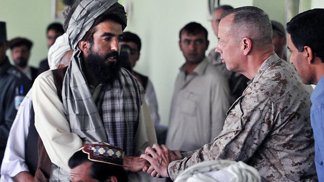 PHOTO: Gen. John Allen, right, greets villagers from the Baraki Barak district, Afghanistan, who recently lost loved ones due to a