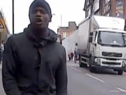 PHOTO: A man that attacked a British soldier in broad daylight reacts to the stabbing in a bystander video obtained by ITV, May 21, 2013.