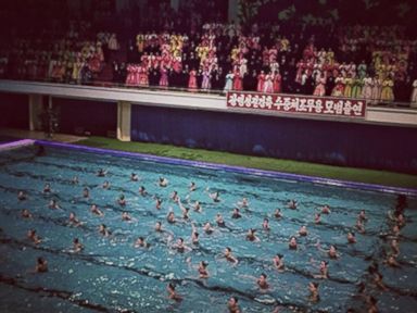 PHOTO: A mass synchronized swimming performance in Pyongyang, in February, 2013. 