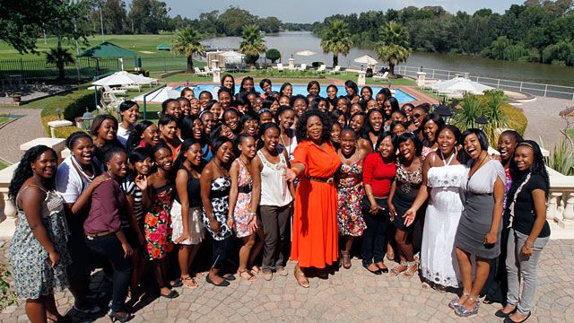 PHOTO: Oprah Winfrey celebrates with the first graduating class of The Oprah Winfrey Leadership Academy for Girls in South Africa.