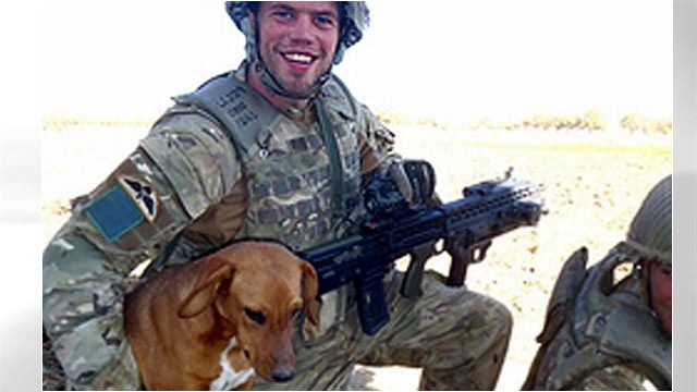 PHOTO:&nbsp;Pte. Conrad Lewis from the 4th Battalion, Parachute Regiment, is shown with his dog, Pegasus.