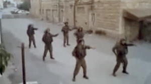 PHOTO The Israeli army is investigating a video posted on Youtube featuring a male soldier performing a belly dancing routine besides a blindfolded female Palestinian prisoner.